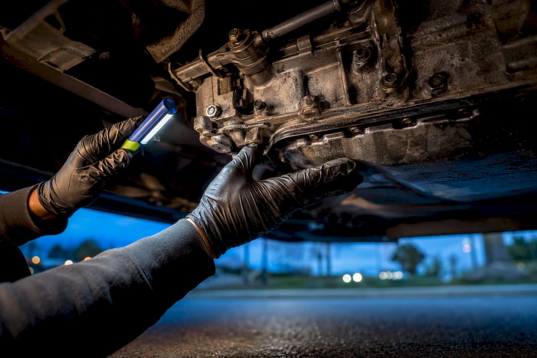 Mechanic inspecting a failed transmission