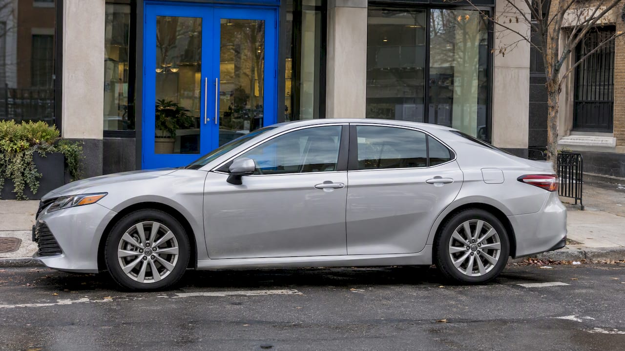 Silver sedan outside a lender branch